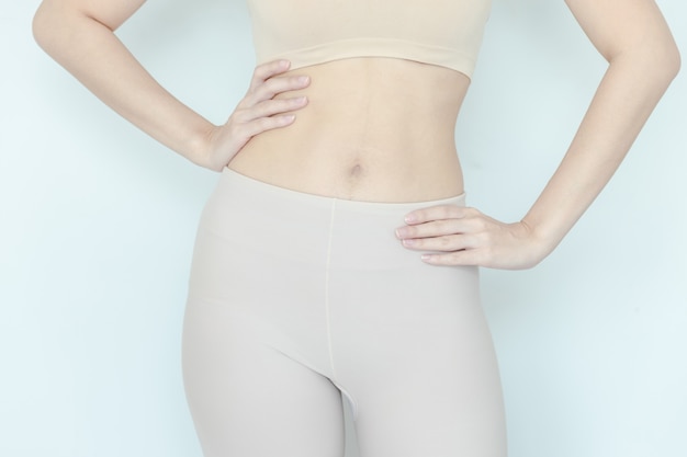 Close up of healthy woman show slim body