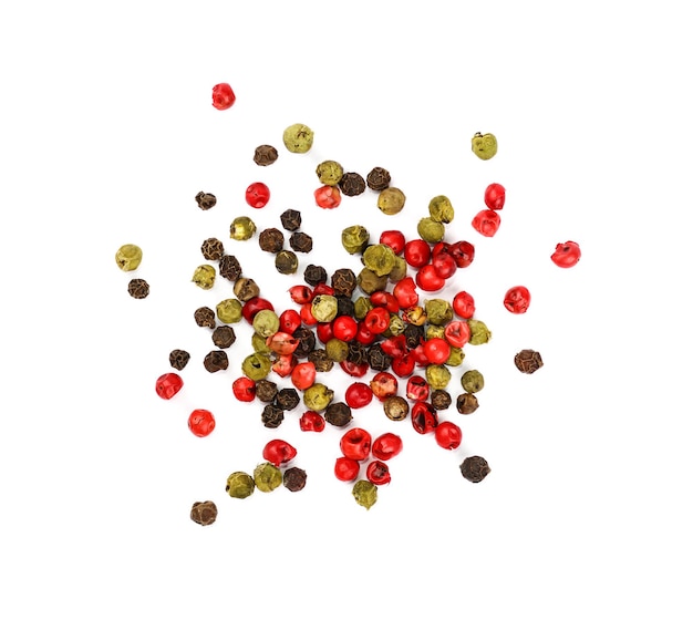 Close up heap of mixed black, green, white and red pink pepper
peppercorns spilled and spread around isolated on white background,
elevated top view, directly above