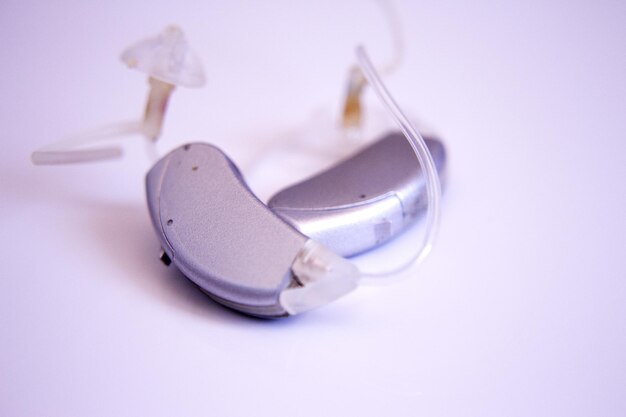 Close-up of hearing aid against white background