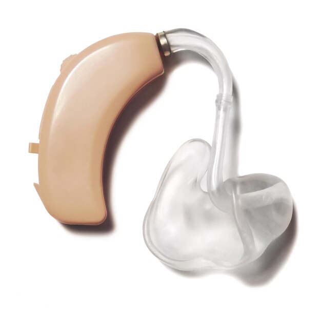 Photo close-up of hearing aid over white background