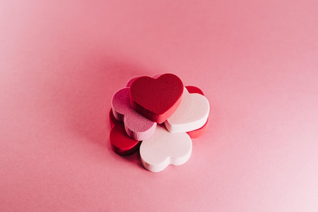 Close-up of heart shape against pink background