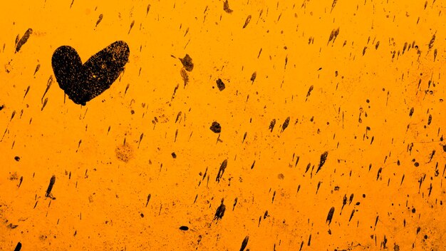 Close-up of heart shape against sky during sunset