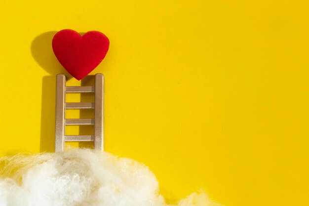 Close-up of heart shape against white wall at home