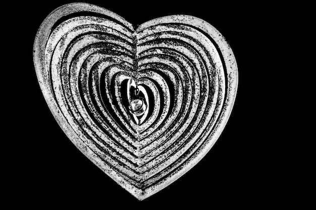 Photo close-up of heart shape decoration against black background