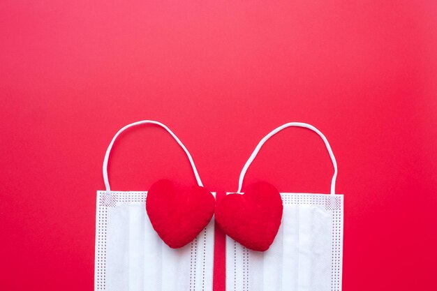 Photo close-up of heart shape on pink against red wall