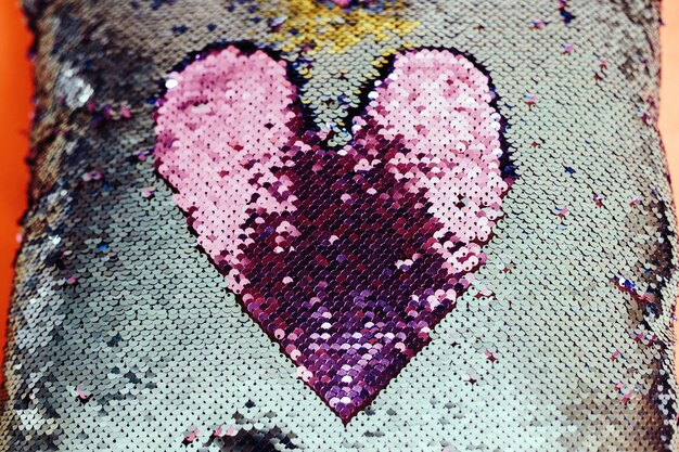 Close-up of heart shape on pink wall