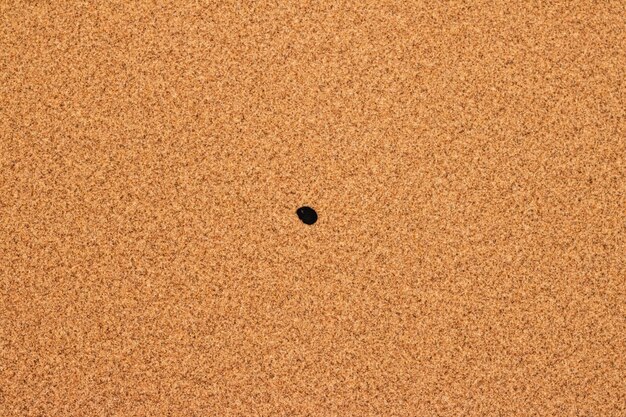 Close-up of heart shape on sand