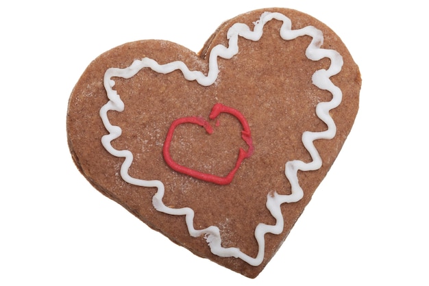 close-up of heart shaped gingerbread cookie on white background
