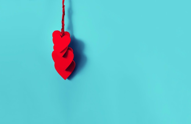 Photo close-up of heart shapes against blue background