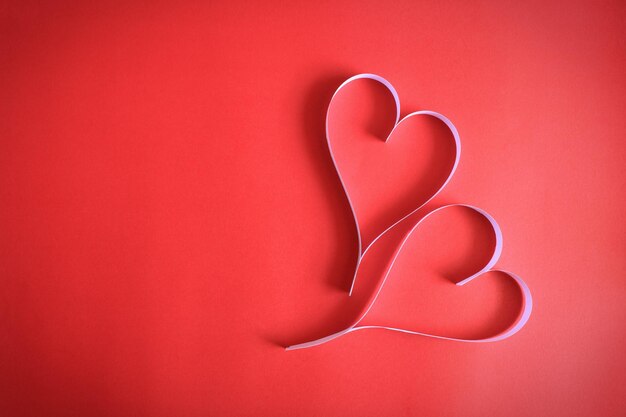 Close-up of heart shapes on red background