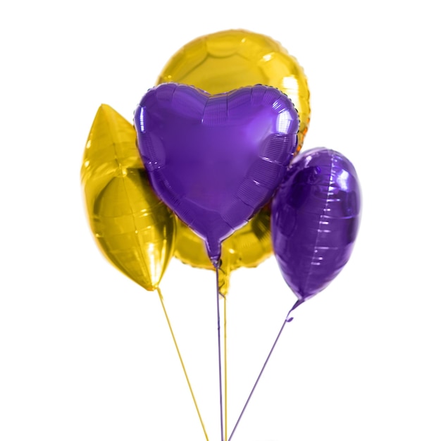 Photo close up of helium balloons over white background