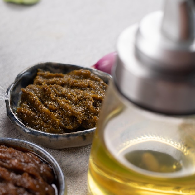 Close up of herbs, spices and olive oil on a table