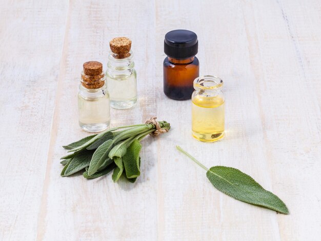 Photo close-up of herbs with liquid on table