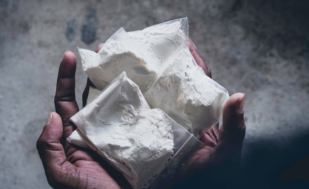 Close up of Heroin drugs in hand