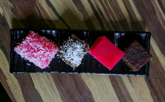 Photo close-up high angle view of colorful sweet food on table