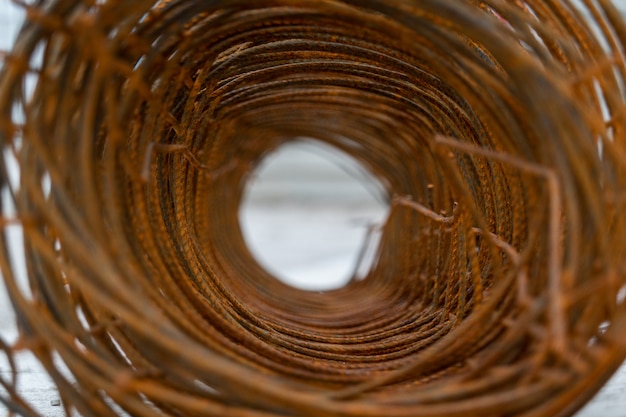 Close up hole of rust barbed wire