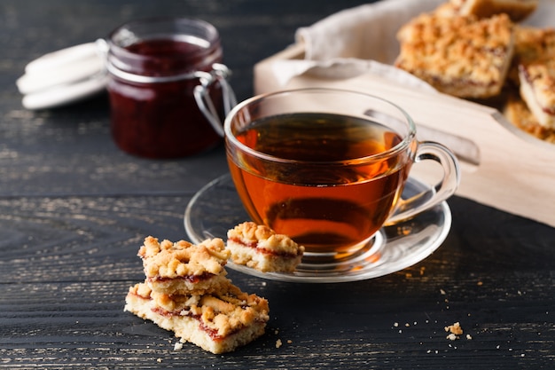 Close-up of home-made biscuits and a cup of tea on the table