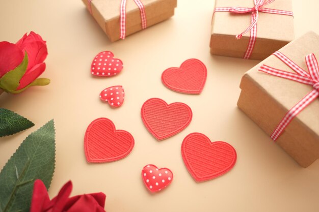 close up of homemade gift box and heart shape symbol on table