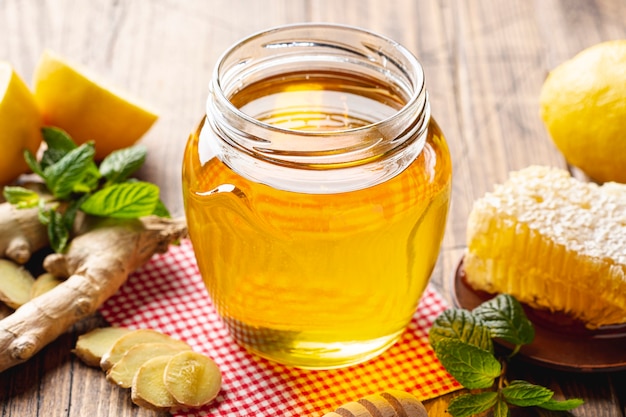 Close up honey jar with honeycomb