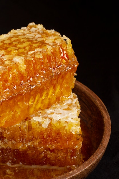 Close-up of honeycomb with honey and beeswax