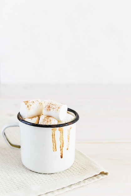 Close up of a hot chocolate and marshmallows with copy space