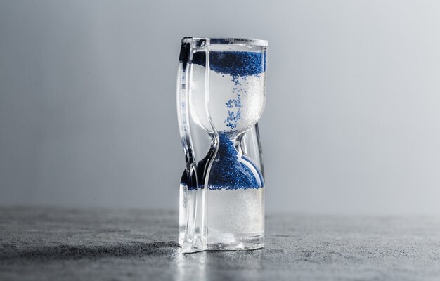 Close up hourglass on table