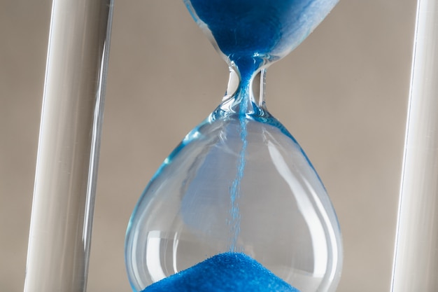 Close up hourglass on table