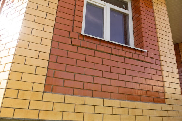 Close up of house wall made of new red brick background.