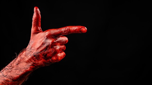 Photo close-up of human hand against black background