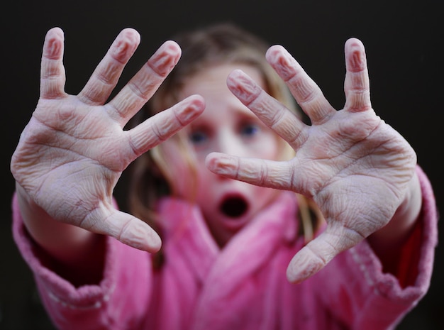 Close-up of human hand against black background