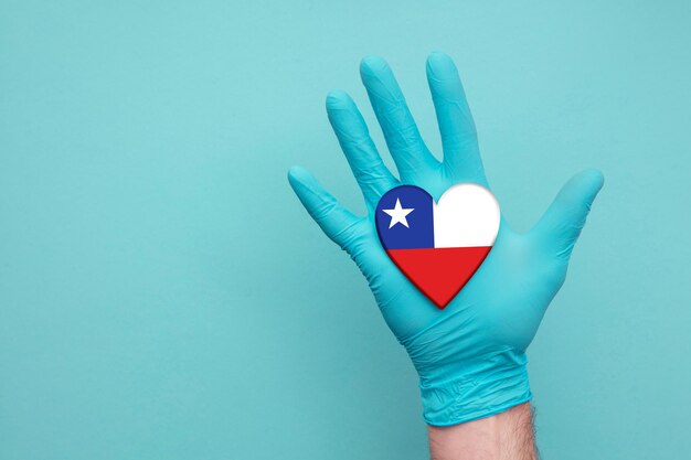 Close-up of human hand against blue background