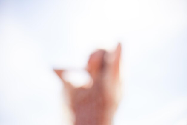 Photo close-up of human hand against sky