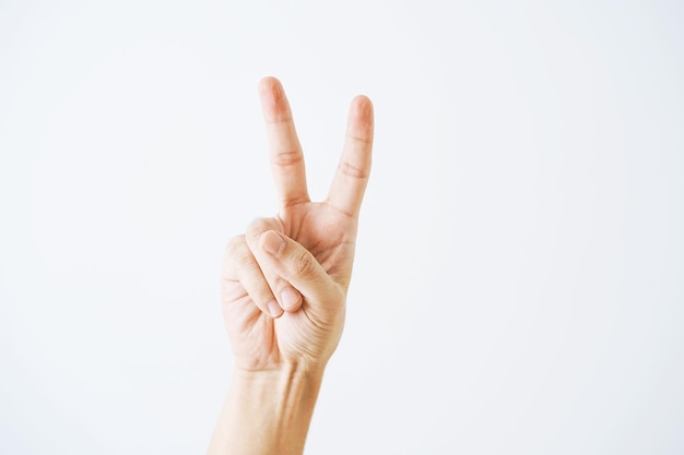 Photo close-up of human hand against white background