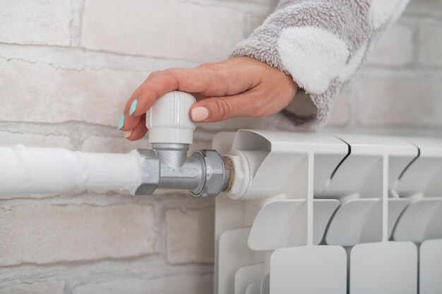 Close-up of human hand holding white wall