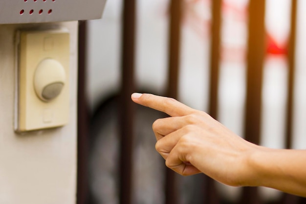 Photo close-up of human hand touching switch light