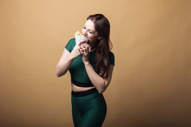 Close up of hungry woman holding food