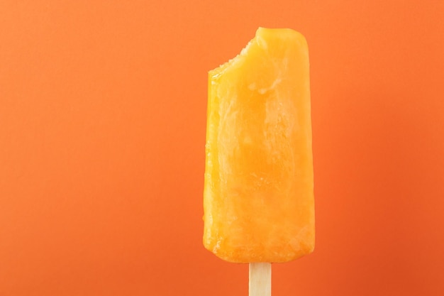 Photo close-up of ice cream against orange background