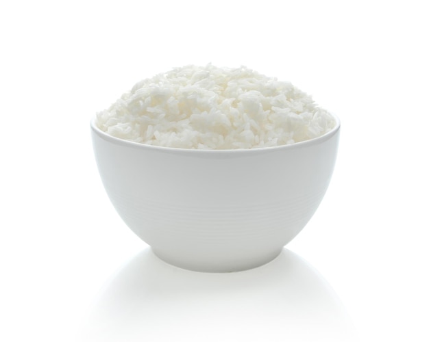 Photo close-up of ice cream in bowl over white background