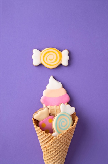 Close-up of ice cream cone against purple background