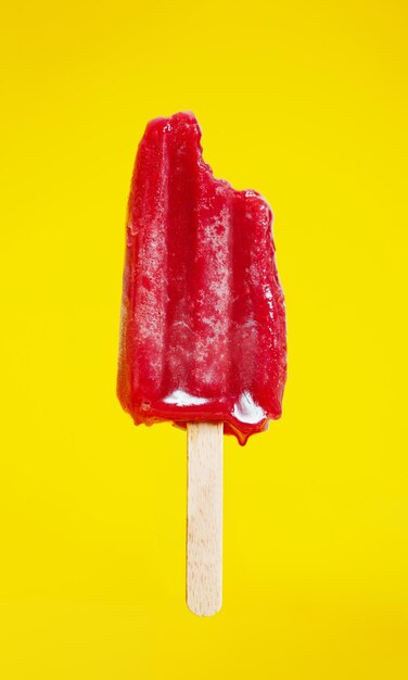 Close-up of ice cream cone against yellow background