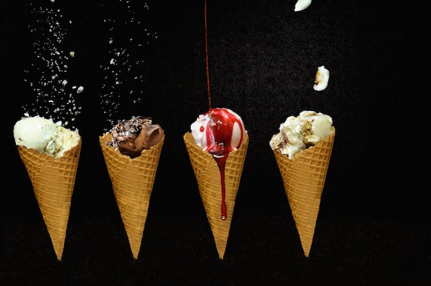 close-up of ice-cream cones against dark background