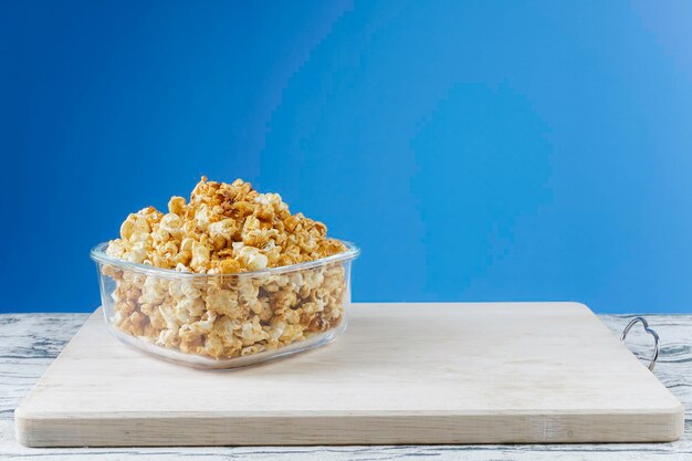 Close-up of ice cream on table against blue background