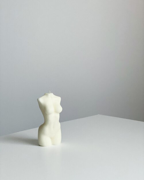 Close-up of ice cream on table against white background