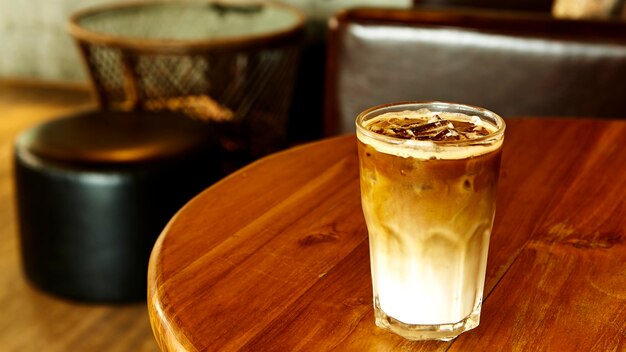 Close-up of iced coffee served on table