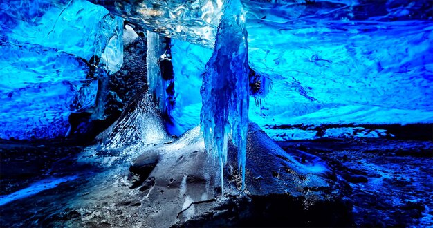 Close-up of icicles on rock in cave