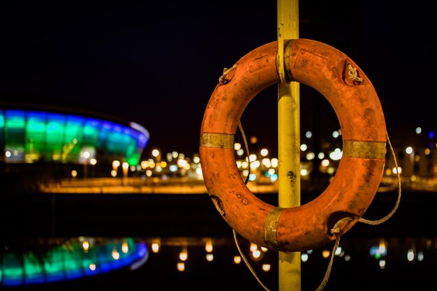 Photo close-up of illuminated boat in city at night