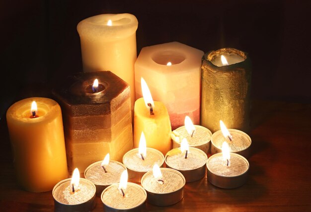 close-up of illuminated candles on table