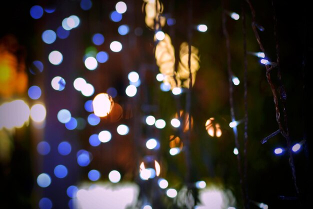 Close-up of illuminated christmas lights in darkroom