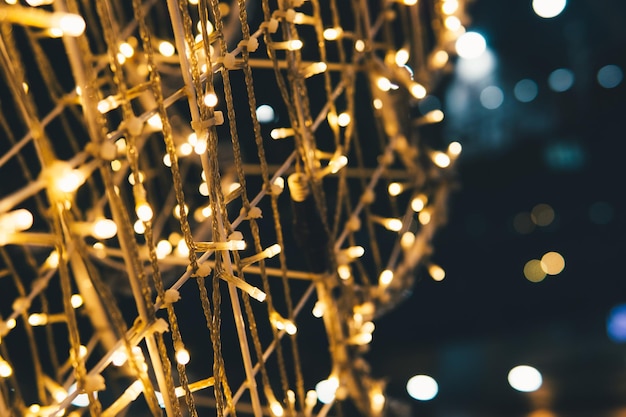 Photo close-up of illuminated christmas lights at night