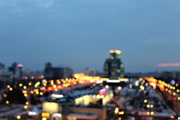 Close-up of illuminated cityscape against sky at night